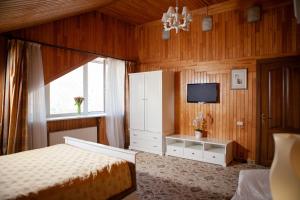 Postel nebo postele na pokoji v ubytování Park Hotel Berezka