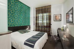 Posteľ alebo postele v izbe v ubytovaní MA Hotel