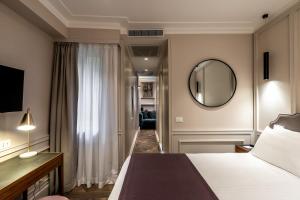 Postel nebo postele na pokoji v ubytování Hotel Smeraldo