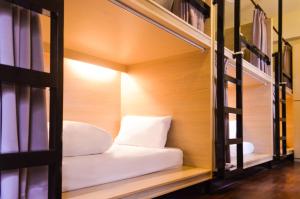 Cama o camas de una habitación en 晶城青年旅館