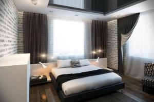 a bedroom with a large bed and a window at Уютная 3 комнатная квартира между Дерибасовской и Аркадией in Odesa