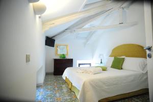 En eller flere senge i et værelse på Maiori Dream Rental