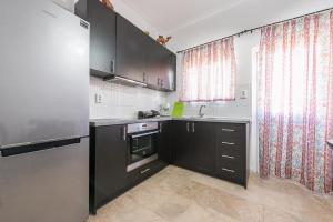 A kitchen or kitchenette at Acropolis View Dream Apartments