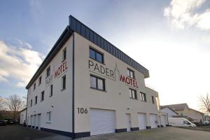 a large white building with the words parlor motel at Pader-Motel in Paderborn