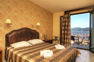 Postel nebo postele na pokoji v ubytování Hotel Tesoro