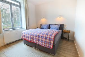 Postel nebo postele na pokoji v ubytování Appartements Villa Schwanenteich