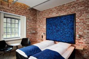Tempat tidur dalam kamar di Hindsgavl Slot