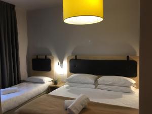 Postel nebo postele na pokoji v ubytování Hotel Centro
