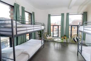 Letto o letti in una camera di Pink Flamingo Boutique Hostel