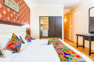 Postel nebo postele na pokoji v ubytování FabHotel Pramila Inn