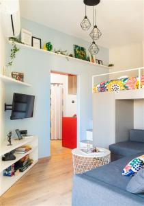 a small living room with a bed and a tv at Deco city center apartment in Heraklio