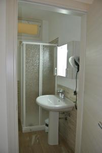 a bathroom with a sink and a shower at Casa Vacanze La Pergola@ in Terrasini