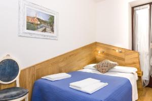 Postel nebo postele na pokoji v ubytování Casa Sottoriva