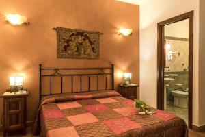 A bed or beds in a room at Alba Marina B&B