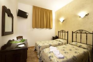 A bed or beds in a room at Alba Marina B&B