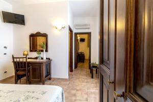 A bed or beds in a room at Alba Marina B&B