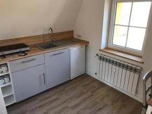 Kuchyňa alebo kuchynka v ubytovaní Apartament na poddaszu