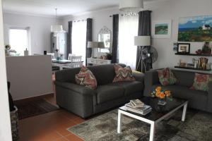 a living room with a couch and a table at Hubbs Place in Sedgefield