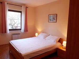 Postel nebo postele na pokoji v ubytování Apartment Maras