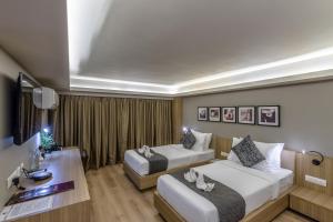 Postel nebo postele na pokoji v ubytování Princeton Club + 20 fotografií