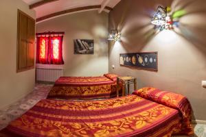 Postel nebo postele na pokoji v ubytování Alqueria De Hurdes