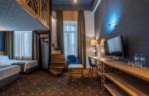 Rúm í herbergi á Gladius Inn Boutique Hotel by DNT Group