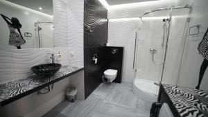 Kúpeľňa v ubytovaní Apartament Delux
