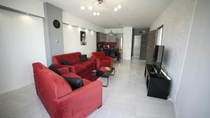Televízia a/alebo spoločenská miestnosť v ubytovaní Apartament Delux