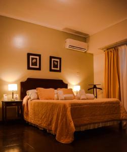 Кровать или кровати в номере Hotel Hernandarias