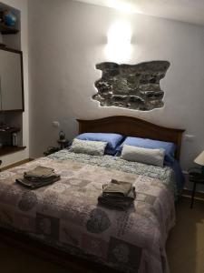 Ένα ή περισσότερα κρεβάτια σε δωμάτιο στο Il nido dei Gabbiani