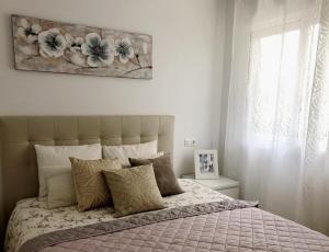 Giường trong phòng chung tại Calle Malta 19 Villa