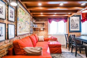 a living room with a couch and a table at Revelton Studios Karlovy Vary in Karlovy Vary