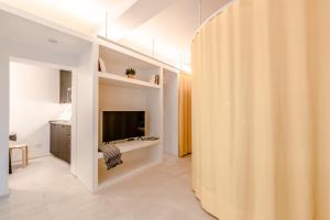 a living room with a large wooden wall at HouSmart Arienti 38a in Bologna