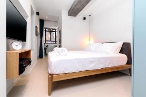 Postel nebo postele na pokoji v ubytování Emanuel Boutique