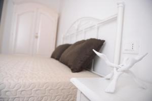 Posteľ alebo postele v izbe v ubytovaní Dimora Pace - ApulianStay Group