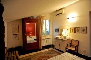 Postel nebo postele na pokoji v ubytování IL golfo artisti e poeti villa thea