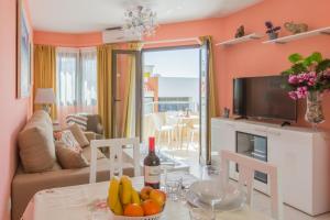 TV a/nebo společenská místnost v ubytování Apartamento Bella Lucia