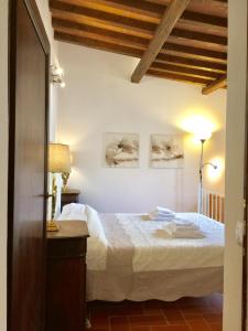 a bedroom with a bed and two pictures on the wall at DaLu Florence apartment Lucilla - private car park 15 minutes to the city center in Florence