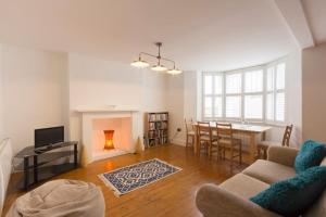 a living room with a table and a dining room at Host & Stay - Victoria Gardens in Ramsgate