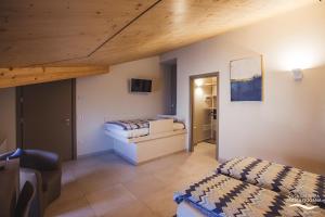 a bedroom with two beds in a room at Antica Dogana in Pisogne