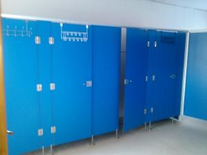 a row of blue lockers in a locker room at albergue camino real in Calzadilla de la Cueza