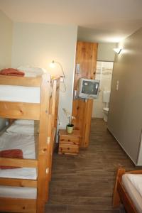 A bed or beds in a room at Polus Pension