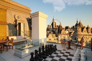 a chessboard on the roof of a building with a city at Corinthia London in London