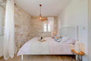 Postel nebo postele na pokoji v ubytování Holiday home Rocca + 36 fotografií