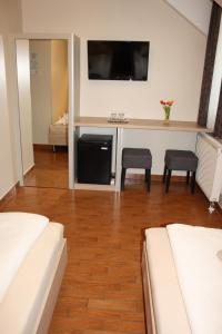 A bed or beds in a room at Polus Pension