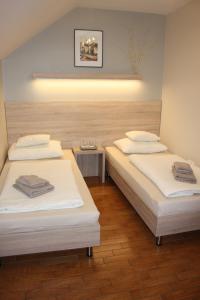 A bed or beds in a room at Polus Pension