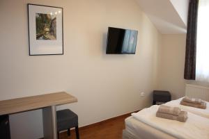 A television and/or entertainment centre at Polus Pension