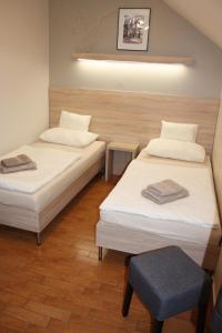 A bed or beds in a room at Polus Pension