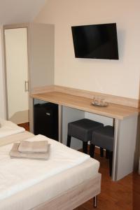 A television and/or entertainment centre at Polus Pension
