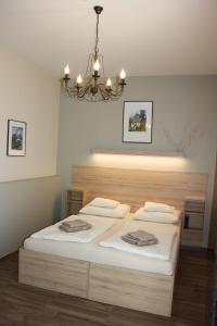 A bed or beds in a room at Polus Pension